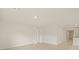 A bright, neutral living space with tile floors adjacent to the kitchen at 3834 Silver Strand Trl, Palmetto, FL 34221