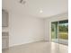 A bright living room featuring large sliding glass doors at 3834 Silver Strand Trl, Palmetto, FL 34221