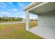 Covered patio offers serene views of a pond and fountain, perfect for relaxation and outdoor enjoyment at 3834 Silver Strand Trl, Palmetto, FL 34221