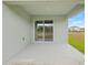 Covered patio area with a sliding glass door and view of the backyard at 3834 Silver Strand Trl, Palmetto, FL 34221