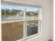 A water view through the window showcases a pond and fountain at 3834 Silver Strand Trl, Palmetto, FL 34221