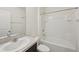 Bright bathroom featuring a vanity, toilet, and shower-tub combo, creating a clean and functional space at 4012 Willow Hammock Dr, Palmetto, FL 34221