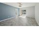 Bright bedroom with sliding glass doors, modern floors and a stylish ceiling fan at 4012 Willow Hammock Dr, Palmetto, FL 34221