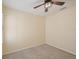 A bright bedroom features a modern ceiling fan with neutral walls and carpet at 4012 Willow Hammock Dr, Palmetto, FL 34221