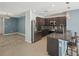 Modern kitchen featuring stainless steel appliances, granite countertops and breakfast bar seating at 4012 Willow Hammock Dr, Palmetto, FL 34221