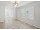 Light and airy living room with large window and modern floors in neutral colors at 4012 Willow Hammock Dr, Palmetto, FL 34221