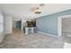 Bright and open living area, stylish kitchen with seating, modern floors, and neutral paint at 4012 Willow Hammock Dr, Palmetto, FL 34221