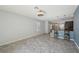 Open-concept living area featuring modern floors and a stylish kitchen with breakfast bar at 4012 Willow Hammock Dr, Palmetto, FL 34221