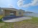 An outdoor patio with a covered section and privacy fence, offering a private and relaxing outdoor space at 4012 Willow Hammock Dr, Palmetto, FL 34221