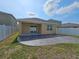 An outdoor patio with a covered section and privacy fence, offering a private and relaxing outdoor space at 4012 Willow Hammock Dr, Palmetto, FL 34221