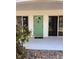 Charming green front door with sidelight windows welcomes you to this lovely home at 4035 S School Ave # D3, Sarasota, FL 34231