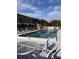 Community pool featuring a table with chairs at 4035 S School Ave # D3, Sarasota, FL 34231