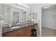 Updated bathroom has a large vanity, granite countertops, Hollywood lighting and closet access at 4037 Crockers Lake Blvd # 17, Sarasota, FL 34238