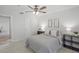Bright bedroom featuring a ceiling fan, tile floors, and neutral decor at 4037 Crockers Lake Blvd # 17, Sarasota, FL 34238