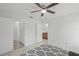Spacious bedroom with ceiling fan, tiled floors and hallway and bathroom access at 4037 Crockers Lake Blvd # 17, Sarasota, FL 34238