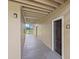Hallway with door number 2017 leading to unit entrance, with stairs and view of trees and water at 4037 Crockers Lake Blvd # 17, Sarasota, FL 34238