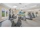 Community gym featuring treadmills, stationary bikes and weight machines with a view of the pool at 4037 Crockers Lake Blvd # 17, Sarasota, FL 34238