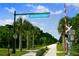 The Legacy Trail with fresh blacktop flanked by palm trees and manicured vegetation at 4037 Crockers Lake Blvd # 17, Sarasota, FL 34238