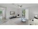 Spacious living area with tile flooring, ceiling fan, sliding glass door and comfortable seating at 4037 Crockers Lake Blvd # 17, Sarasota, FL 34238