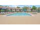 Large community pool with lounge chairs and umbrellas for relaxation at 4037 Crockers Lake Blvd # 17, Sarasota, FL 34238