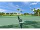 Well-maintained tennis court with a net at 4037 Crockers Lake Blvd # 17, Sarasota, FL 34238
