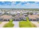 Gorgeous aerial view of a modern home, three-car garage, and waterway access in a meticulously landscaped community at 4312 Vasco St, Punta Gorda, FL 33950