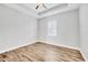 This bedroom features hardwood floors, a ceiling fan, recessed lighting and white walls at 4312 Vasco St, Punta Gorda, FL 33950