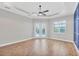 Bedroom features a tray ceiling, ceiling fan, and private access to the pool area at 4312 Vasco St, Punta Gorda, FL 33950