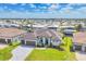Beautiful single-story home with a well-manicured lawn, dark brown tiled roof, paver driveway and an attached three-car garage at 4312 Vasco St, Punta Gorda, FL 33950