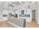 Modern kitchen featuring white cabinets, stainless steel appliances, decorative backsplash and a center island at 4312 Vasco St, Punta Gorda, FL 33950