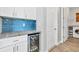 Wet bar area next to laundry room with built-in wine fridge and ample counter space at 4312 Vasco St, Punta Gorda, FL 33950