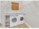 Laundry room featuring a granite countertop, full size washer and dryer and wire shelving at 4312 Vasco St, Punta Gorda, FL 33950
