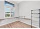 This home office includes hardwood floors, a built-in desk and shelving unit and a large window at 4312 Vasco St, Punta Gorda, FL 33950