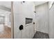 Walk-in shower features dual shower heads, mosaic tile floor, and white tile walls at 4312 Vasco St, Punta Gorda, FL 33950