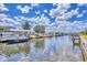 Scenic waterfront view of a calm canal lined with private boat docks, lush landscaping, and beautiful homes at 4312 Vasco St, Punta Gorda, FL 33950