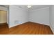 This bedroom features wood floors and a ceiling fan at 4471 Atwood Cay Cir # 13, Sarasota, FL 34233