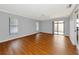 Bedroom has fan, wood floors, and sliding glass doors at 4471 Atwood Cay Cir # 13, Sarasota, FL 34233