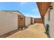 Private courtyard with paver stones, planters, garden hose, and privacy fences at 4471 Atwood Cay Cir # 13, Sarasota, FL 34233
