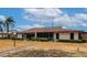 Well-maintained property with lush green lawn and mature tropical landscaping and screened-in porch at 4471 Atwood Cay Cir # 13, Sarasota, FL 34233