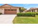 Charming single-Gathering home features an attached two-car garage and manicured front lawn at 4471 Atwood Cay Cir # 13, Sarasota, FL 34233