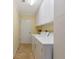 Laundry room with modern washer and dryer, storage cabinets and neutral paint at 4471 Atwood Cay Cir # 13, Sarasota, FL 34233