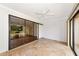Bright living room with neutral paint, tile flooring, and a sliding glass door to screened patio at 4471 Atwood Cay Cir # 13, Sarasota, FL 34233