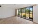 Living room features tile floors and sliding glass doors to the outdoors at 4471 Atwood Cay Cir # 13, Sarasota, FL 34233