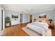 Large main bedroom features contemporary decor, walk-in closet, and wood flooring at 4471 Atwood Cay Cir # 13, Sarasota, FL 34233