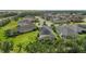 Aerial view of a lush backyard with private screened pool, surrounded by beautiful landscaping at 4542 Cedar Brush Ter, Sarasota, FL 34243