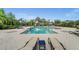 Inviting community pool with lounge chairs, and a sunny deck, offering a perfect spot for relaxation and socializing at 4542 Cedar Brush Ter, Sarasota, FL 34243