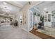 Open-concept entryway leading to a well-lit home office and the main living area at 4542 Cedar Brush Ter, Sarasota, FL 34243