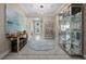 Spacious foyer features neutral tones and an elegant display cabinet at 4542 Cedar Brush Ter, Sarasota, FL 34243