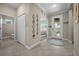 Bright and spacious foyer with tile flooring and a decorative rug at 4542 Cedar Brush Ter, Sarasota, FL 34243