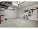 Organized two-car garage features ample storage and a clean epoxy floor, blending functionality with a modern aesthetic at 4542 Cedar Brush Ter, Sarasota, FL 34243